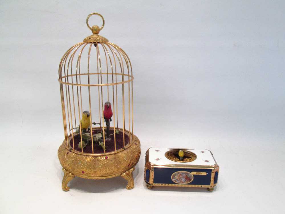 Appraisal: TWO GERMAN SINGING BIRDS the first of bird cage form