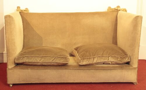 Appraisal: An upholstered Knowle settee the tall back and sides with