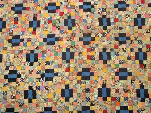 Appraisal: An American pieced cotton quilt Worked with an all-over pattern