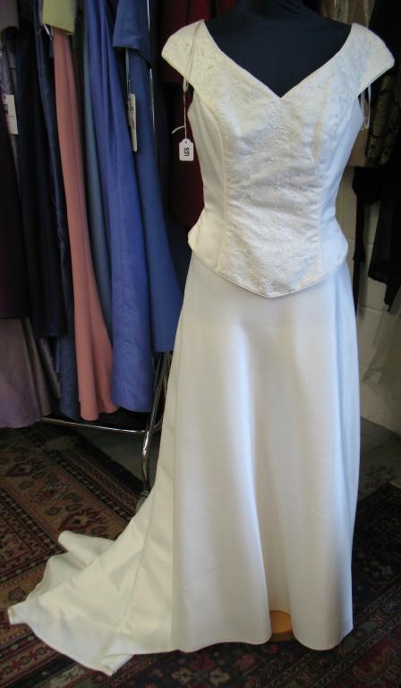 Appraisal: Romantica A full length cream satin wedding skirt falling into