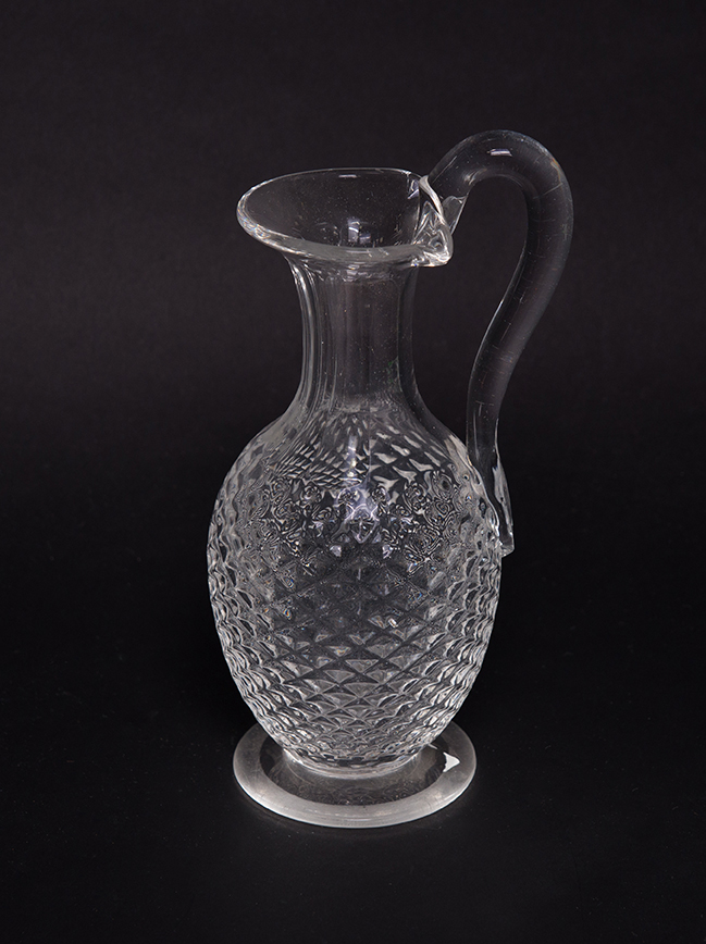 Appraisal: BLOWN AND CUT CLEAR GLASS CLARET JUG England mid th