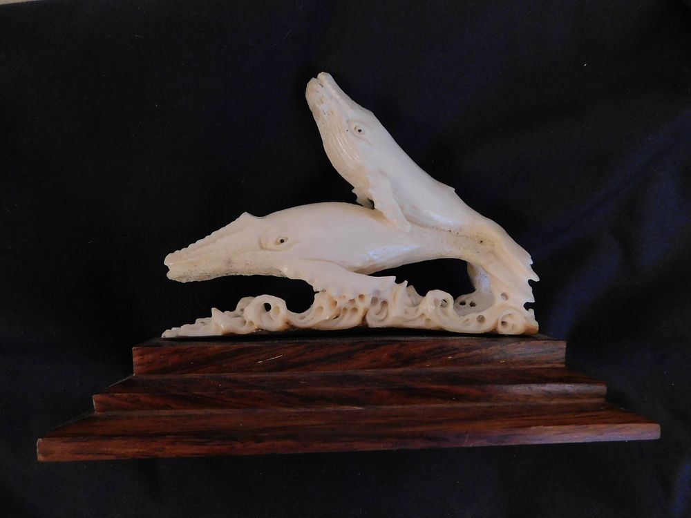 Appraisal: ANTLER CARVING WITH WHALES Finely carved antler bone depicting whales