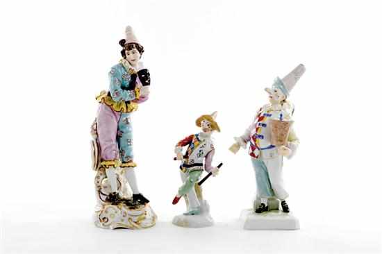 Appraisal: German porcelain harlequin figures each in jovial stance marked Dresden