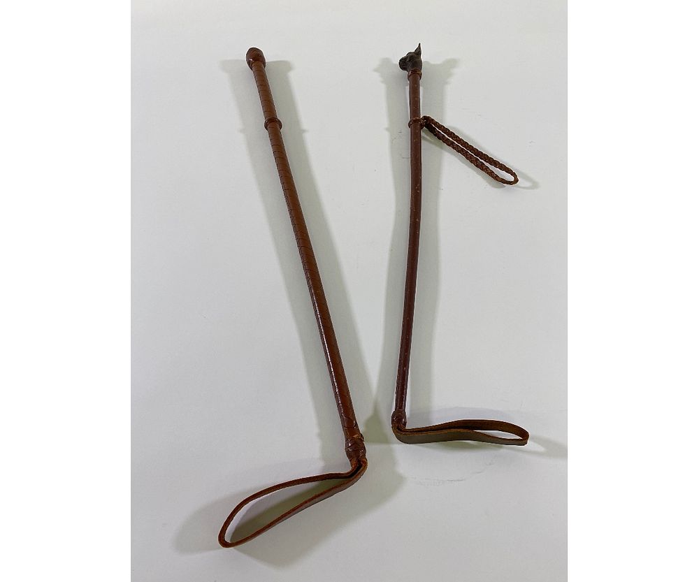 Appraisal: Two Leather Riding Crops Two leather covered riding crops one