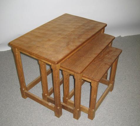 Appraisal: A NEST OF THREE ADZED OAK TABLES by Robert Mouseman