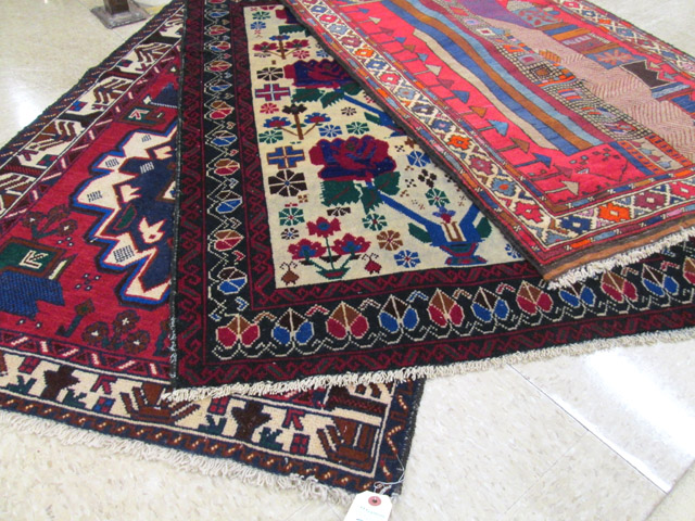 Appraisal: THREE AFGHANI TRIBAL AREA RUGS various patterns all hand knotted