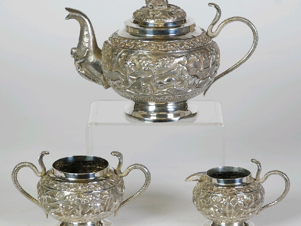 Appraisal: INDIAN NINETEENTH CENTURY TEA SERVICE OF PIECES globular and repousse