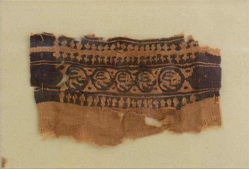 Appraisal: TWO COPTIC TEXTILE FRAGMENTS The one with oval enclosing a