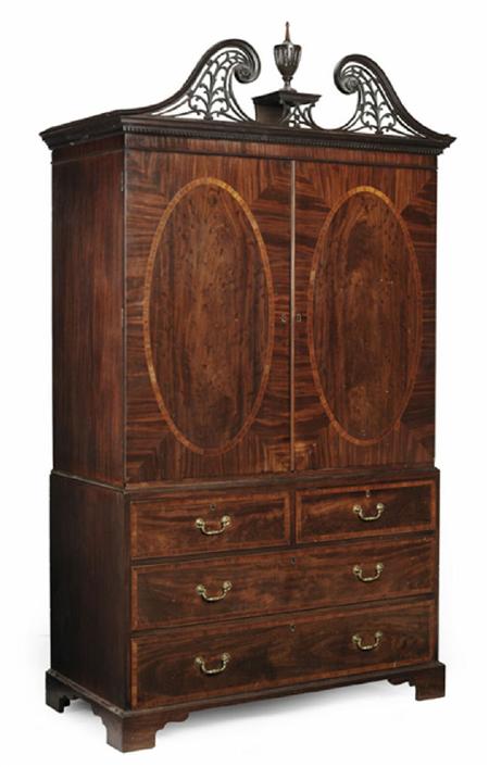 Appraisal: A George III mahogany linen press the carved and fretted