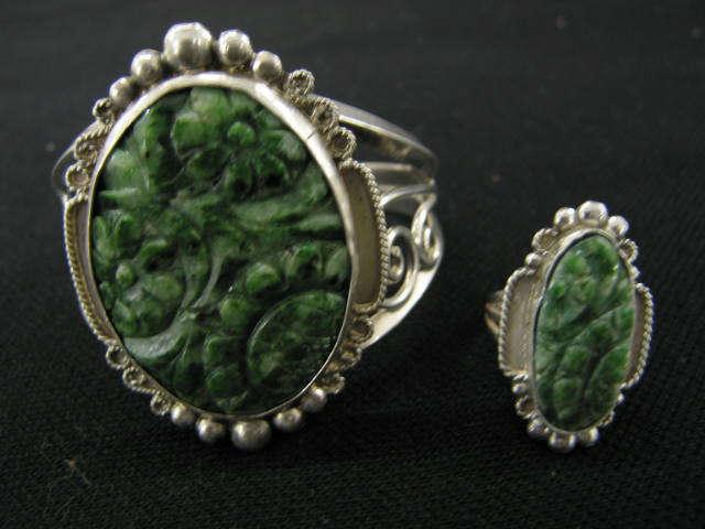 Appraisal: Carved Jade Sterling Bracelet Ring floral decor set in sterling