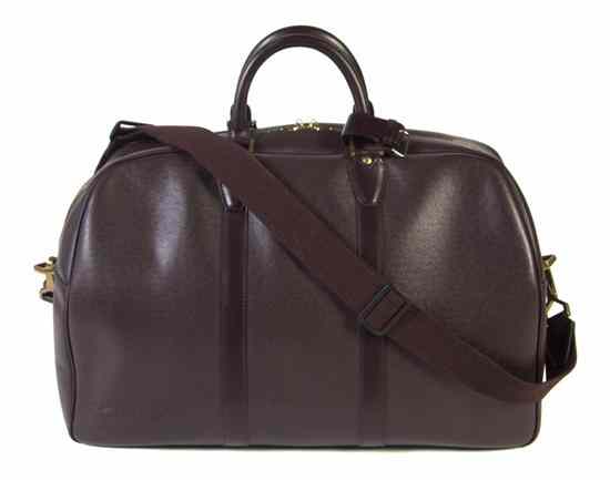 Appraisal: A Louis Vuitton Burgundy Leather Travel Bag Stamped Louis Vuitton