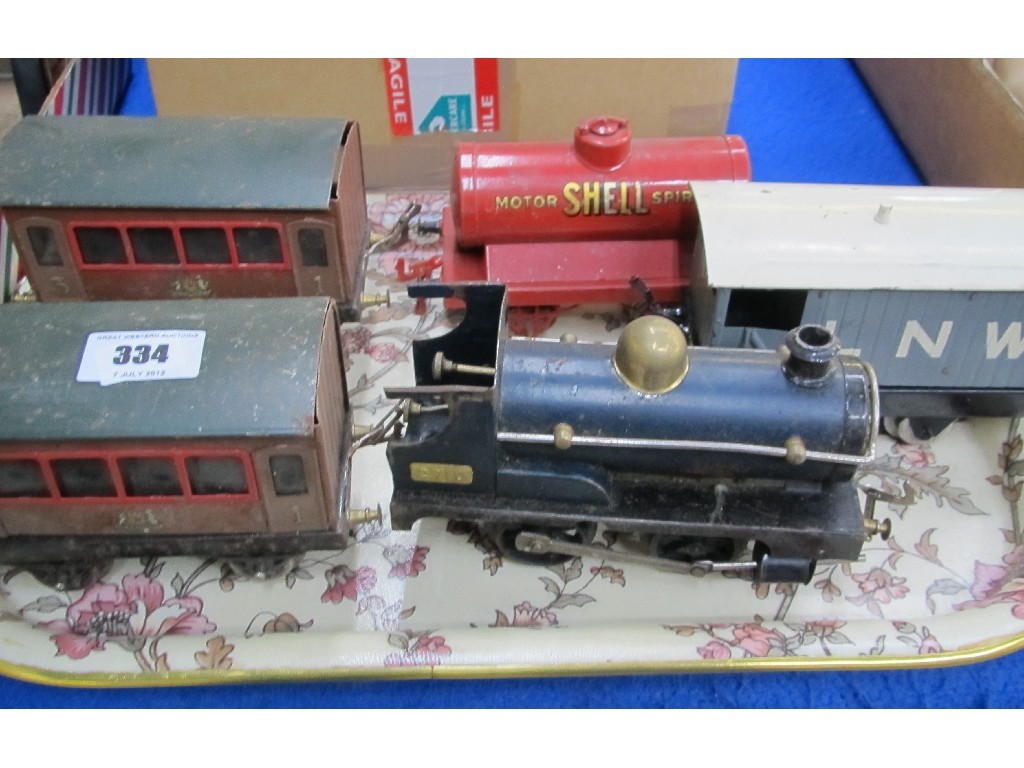 Appraisal: A tinplate train engine carriages and tanker