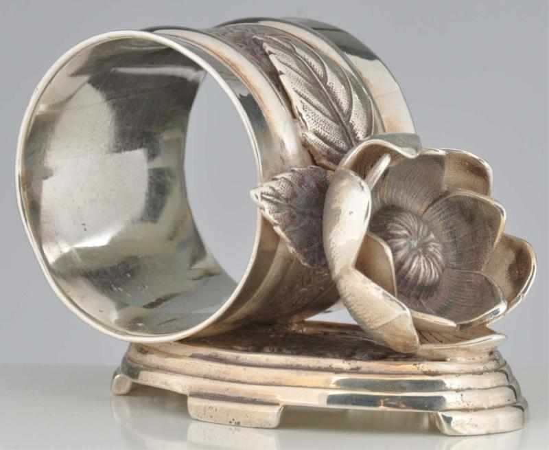 Appraisal: Flower on Tiered Oval Base Figural Napkin Ring By William