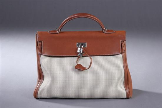 Appraisal: HERMES KELLY HANDBAG WITH PADLOCK Leather handle tan fabric exterior