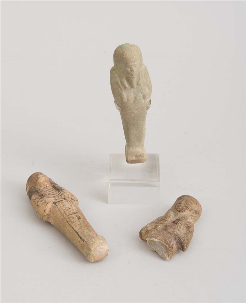 Appraisal: TWO EGYPTIAN FAIENCE AND POTTERY USHABTIS AND FRAGMENT One raised