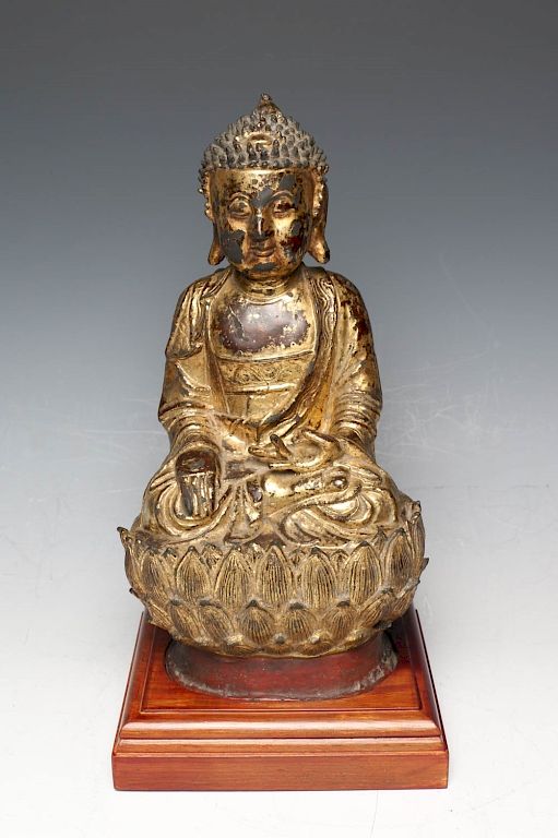 Appraisal: LACQUERED GILT BRONZE SEATED FIGURE OF BUDDHA SHAKYAMUNI Depicting a