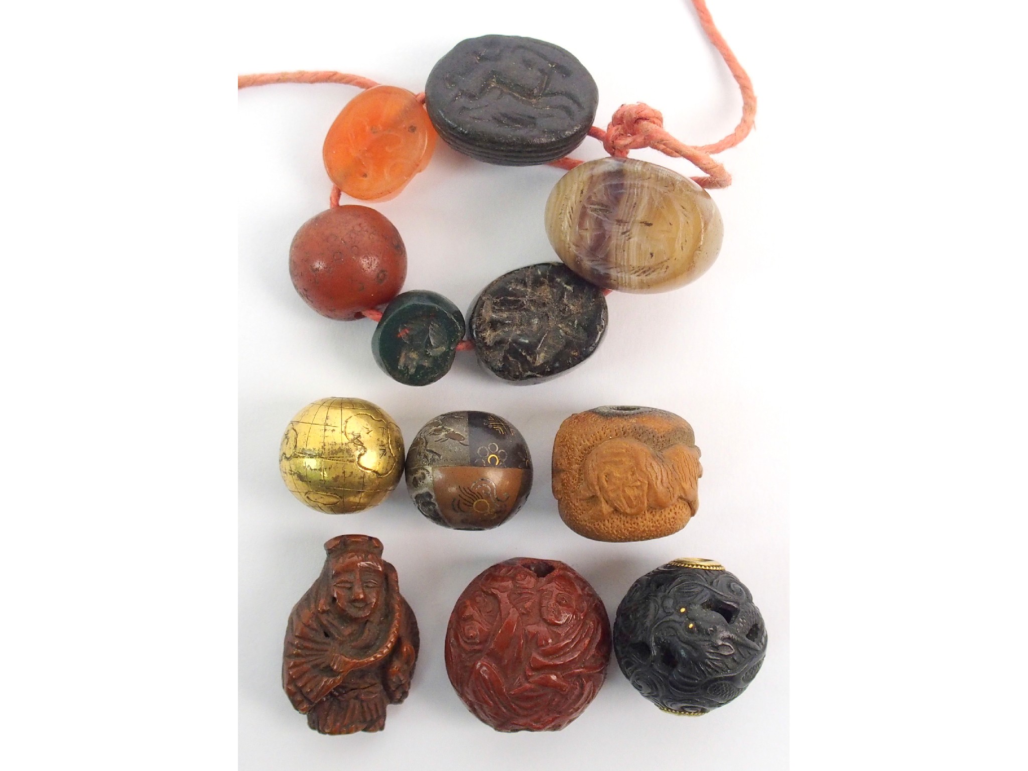 Appraisal: Six Roman hardstone sealstwo Ojime peach nut boxwood bead carved