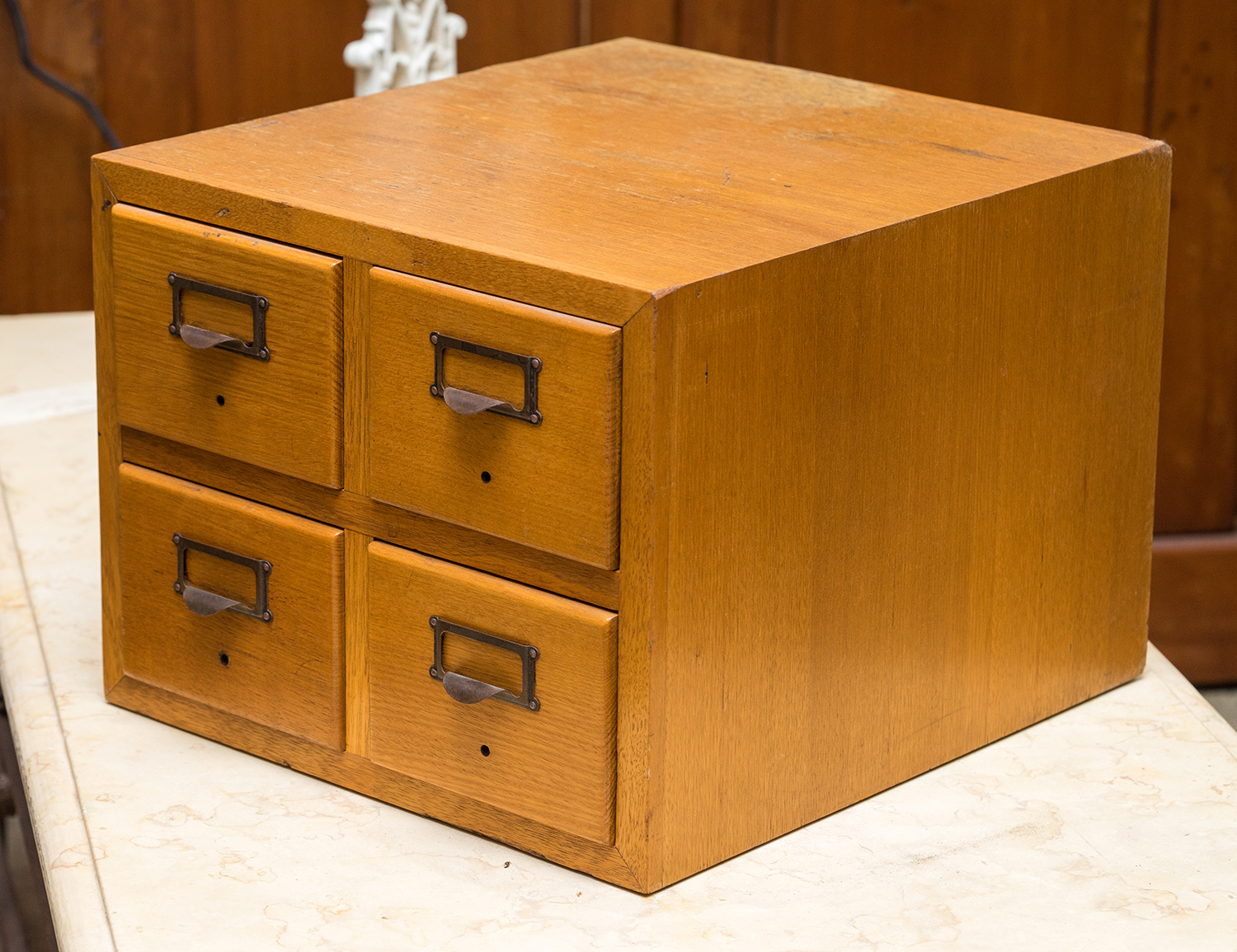 Appraisal: A MINIATURE FOUR DRAWER FILING CHEST Oak with metal fittings