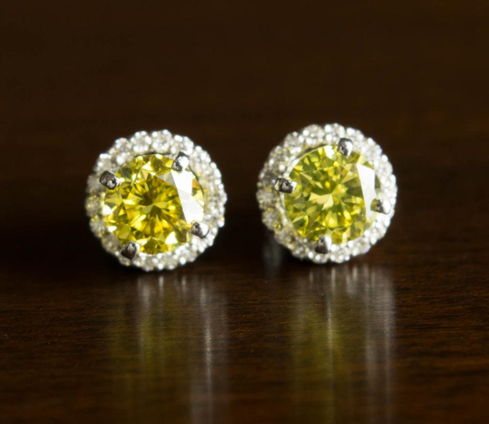 Appraisal: PAIR OF YELLOW DIAMOND EAR STUDS WITH EARRINGS JACKETS each