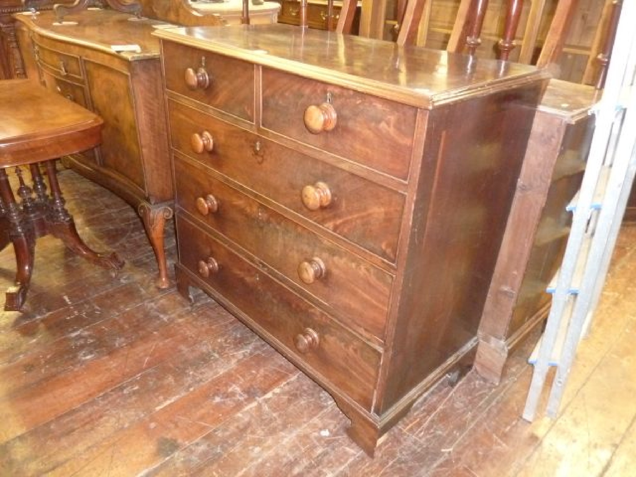 Appraisal: A Georgian mahogany chest of three long and two short