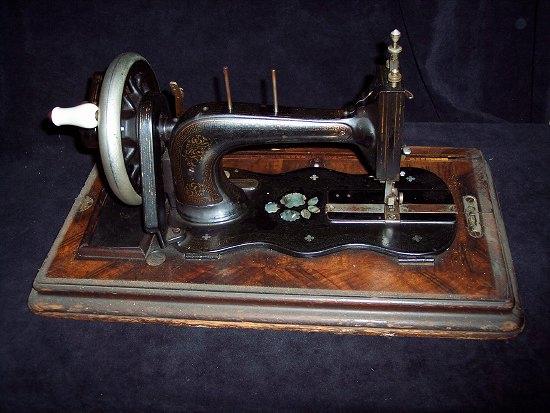 Appraisal: A sewing machine with gilt decoration and inlaid abalone shell