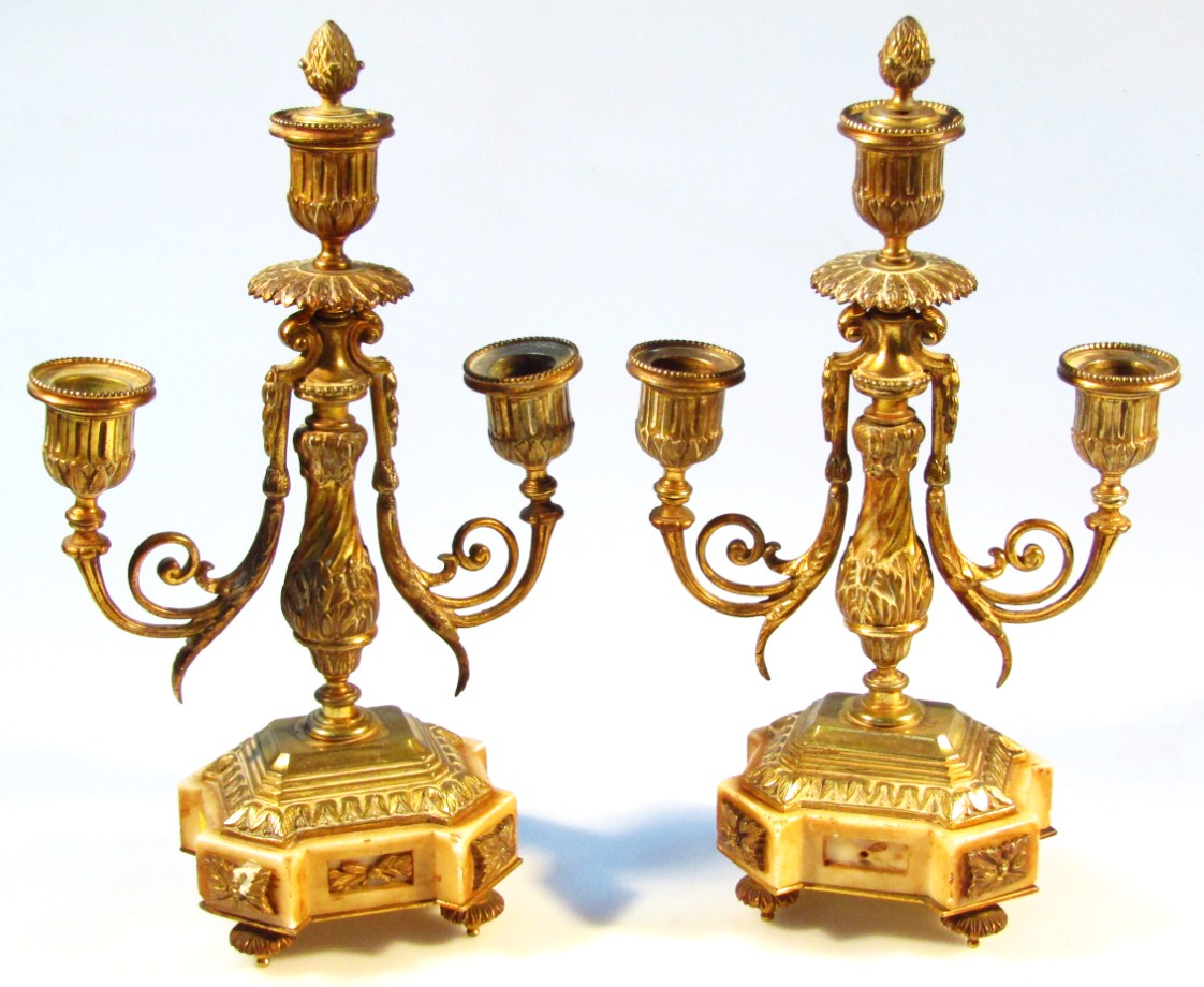 Appraisal: A pair of Regency style brass and marble candlestick garniture