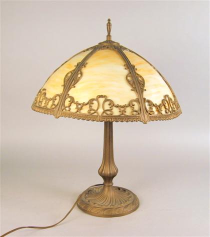 Appraisal: American art nouveau style lamp With a carmel glass shade