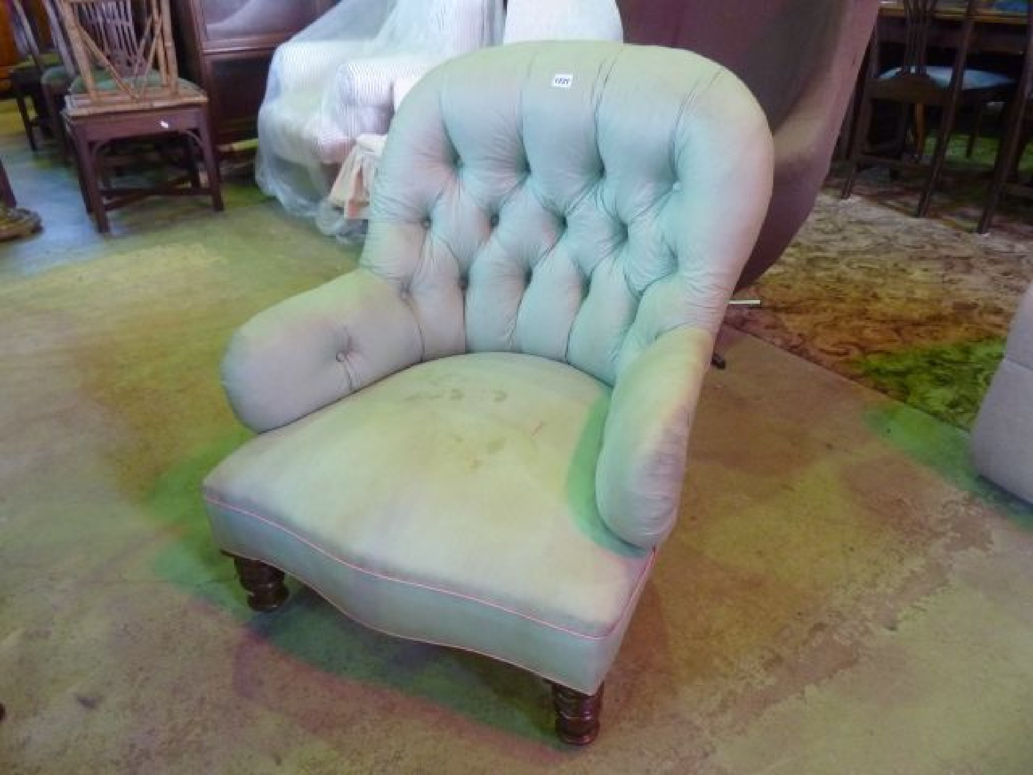 Appraisal: A Victorian drawing room chair with upholstered button framework on