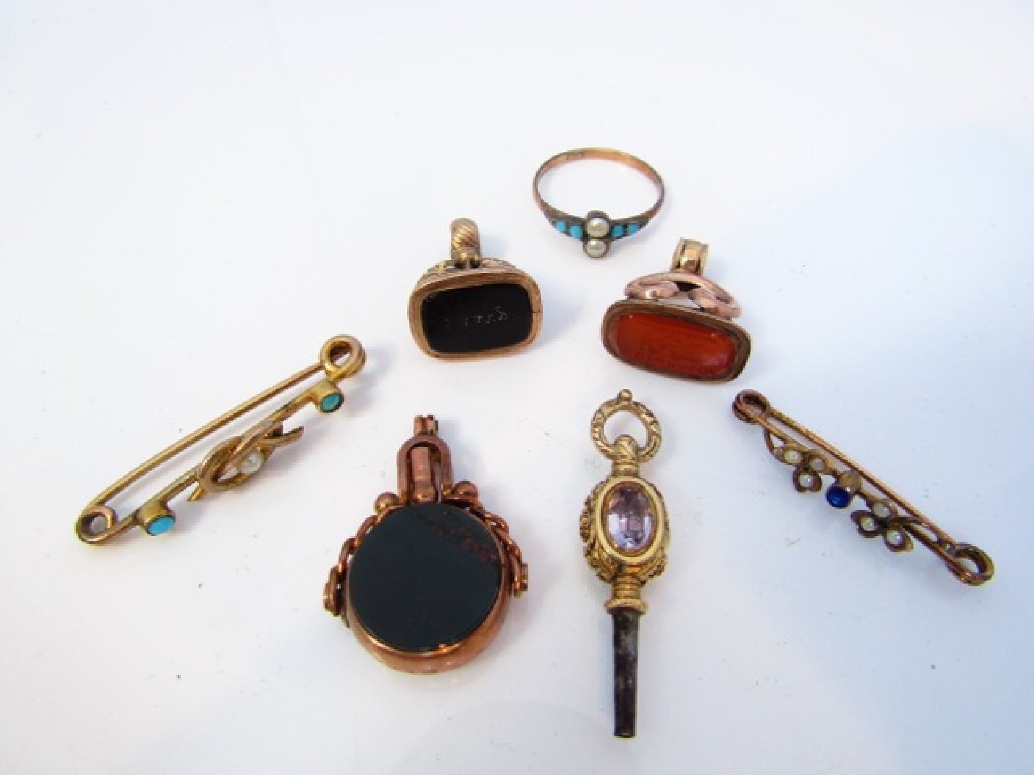 Appraisal: A Victorian swivel seal fob watch key pendant inset with