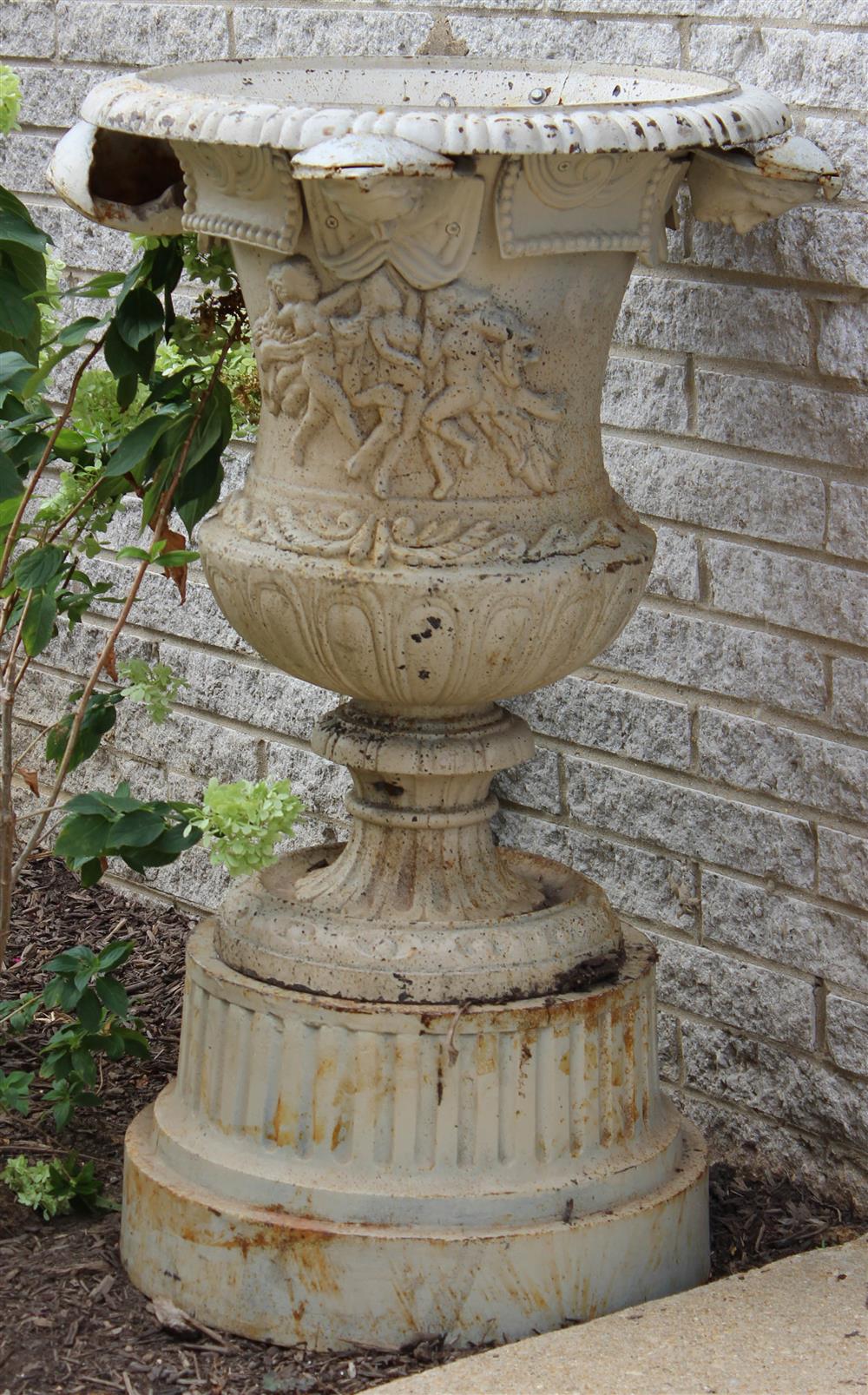 Appraisal: TWO LARGE CAST-IRON URNS ON PEDESTALS each with a decorative