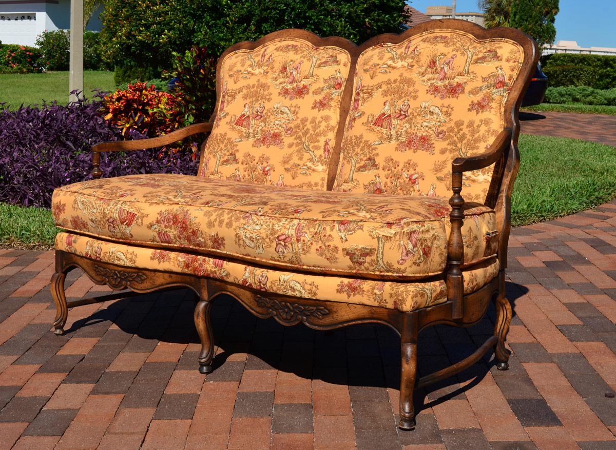 Appraisal: COUNTRY FRENCH TOILE FABRIC SETTEE Shaped back and arms carved