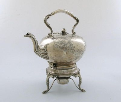 Appraisal: A Victorian Scottish silver kettle of circular form engraved foliate