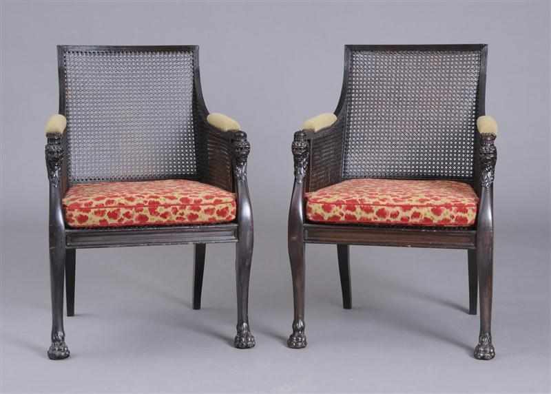 Appraisal: PAIR OF REGENCY STYLE DARK BROWN-STAINED AND CARVED LIBRARY ARMCHAIRS