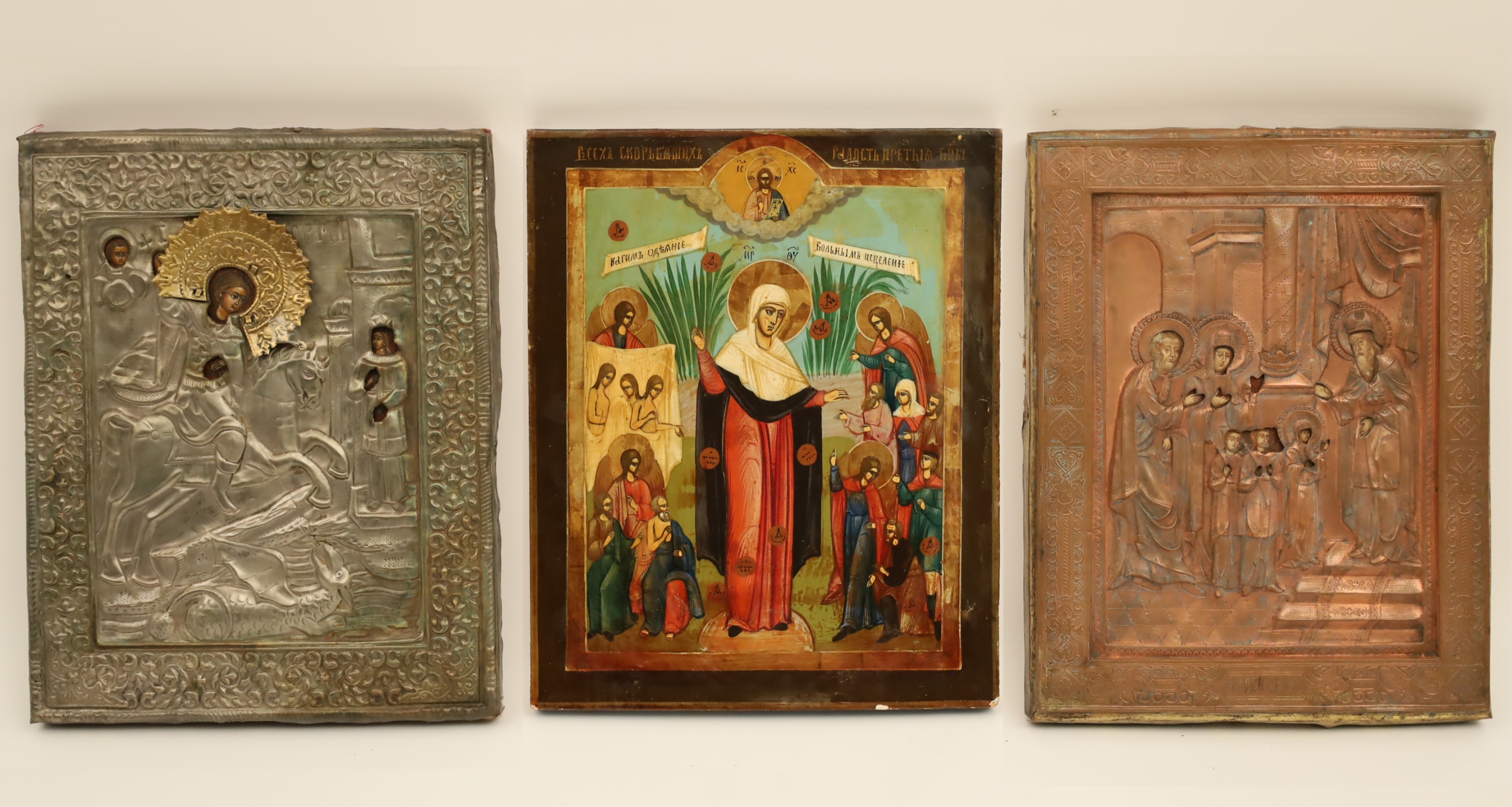 Appraisal: GROUP OF RUSSIAN ICONS A metal and gilt oklad icon