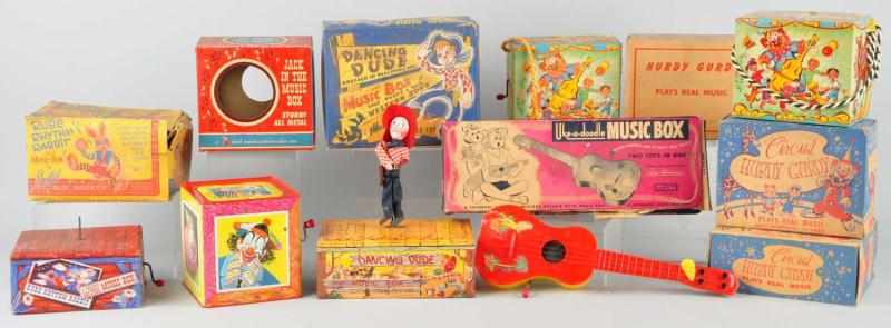 Appraisal: Lot of Hurdy Gurdy Music Box Toys Description Most appear