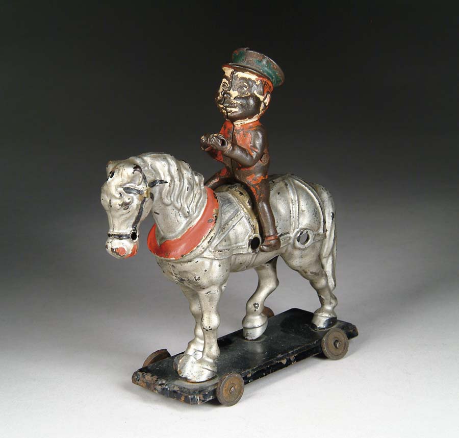 Appraisal: BROWNIE ATOP HORSE Manufactured by Hubley Mfg Co A rare