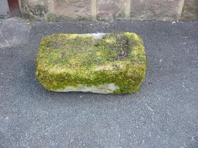 Appraisal: A YORKSHIRE STONE TROUGH of rough hewn oblong form x