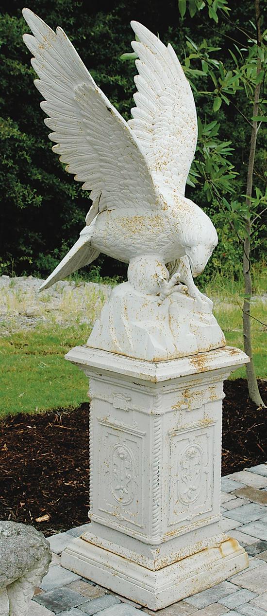 Appraisal: Pair cast-iron eagles on stands birds with outstreched wings on