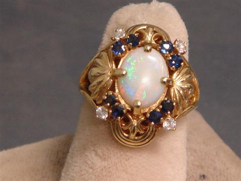 Appraisal: K YG opal diamond and sapphire ring mm x mm