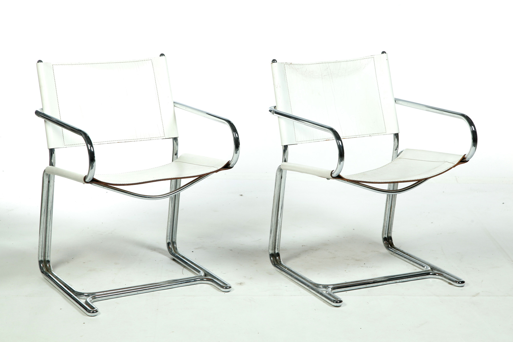 Appraisal: SET OF FOUR CHROME AND LEATHER ARMCHAIRS s White leather