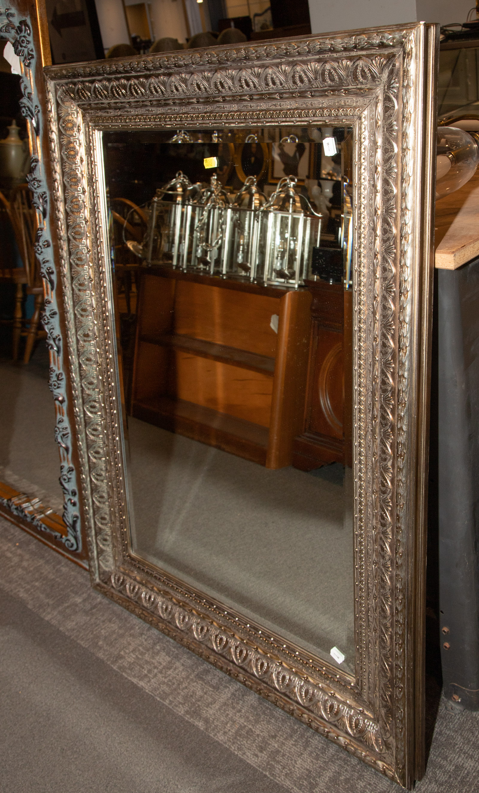 Appraisal: LARGE NEOCLASSICAL STYLE MIRROR Modern with molded silver-gilt frame approximately