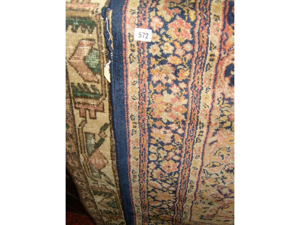 Appraisal: An eastern wool carpet with stylised floral decoration in red