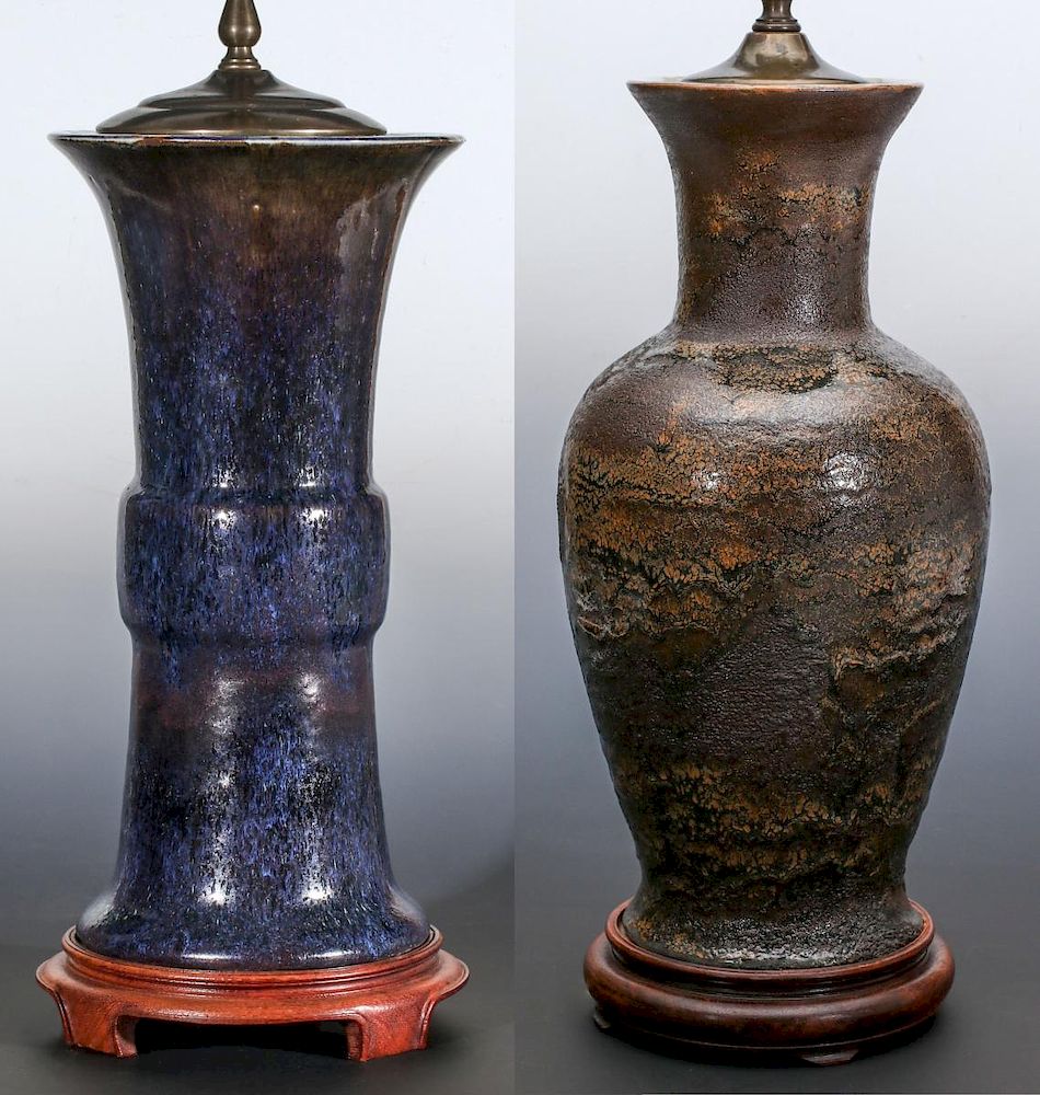 Appraisal: THREE POTTERY TABLE LAMPS MIDDLE TH CENTURY A crack glaze