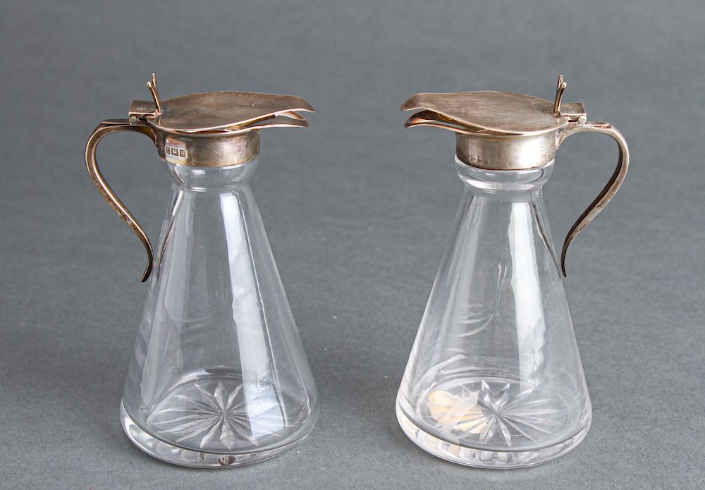 Appraisal: Barker Bros Silver Crystal Syrup Pitchers Pair Pair of Barker