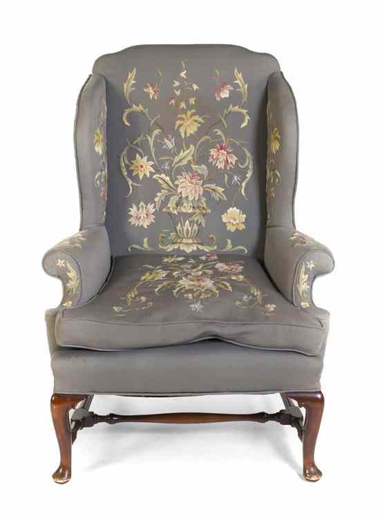 Appraisal: A Needlework Upholstered Wingback Armchair the back sides and seat