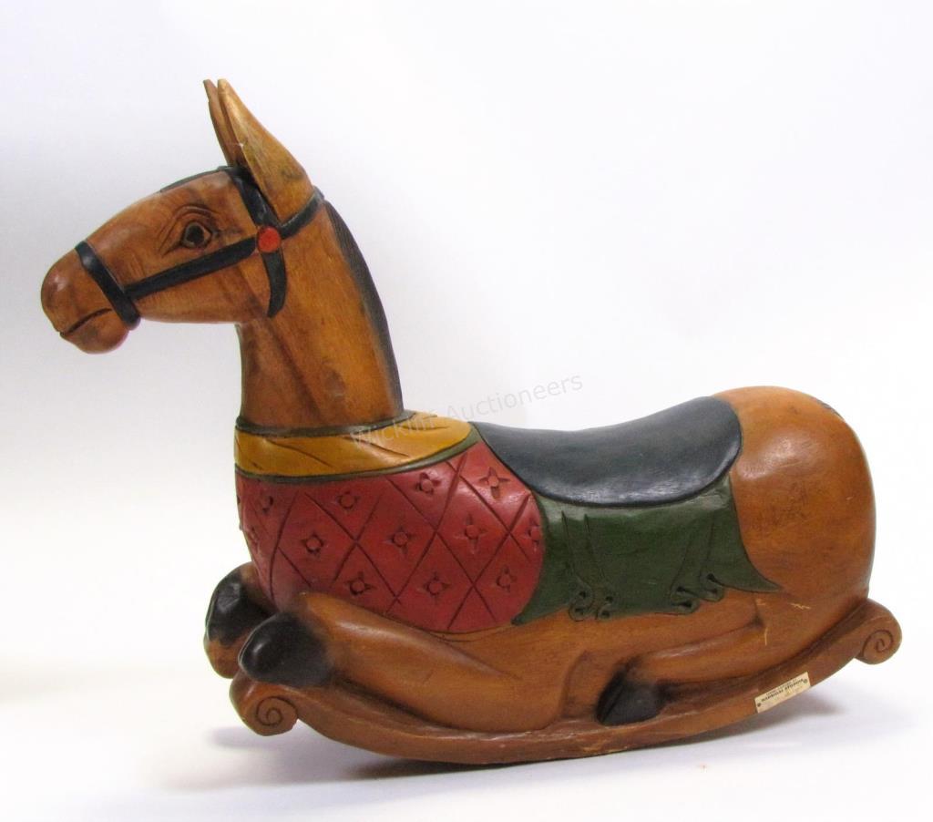 Appraisal: A Madrigal Studios carved wood rocking horse painted and natural