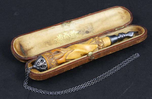 Appraisal: Silver and carved amber Torah pointer in fitted case marked