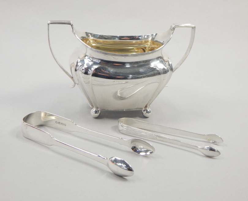 Appraisal: An Edwardian silver two handled sugar bowl with bun feet