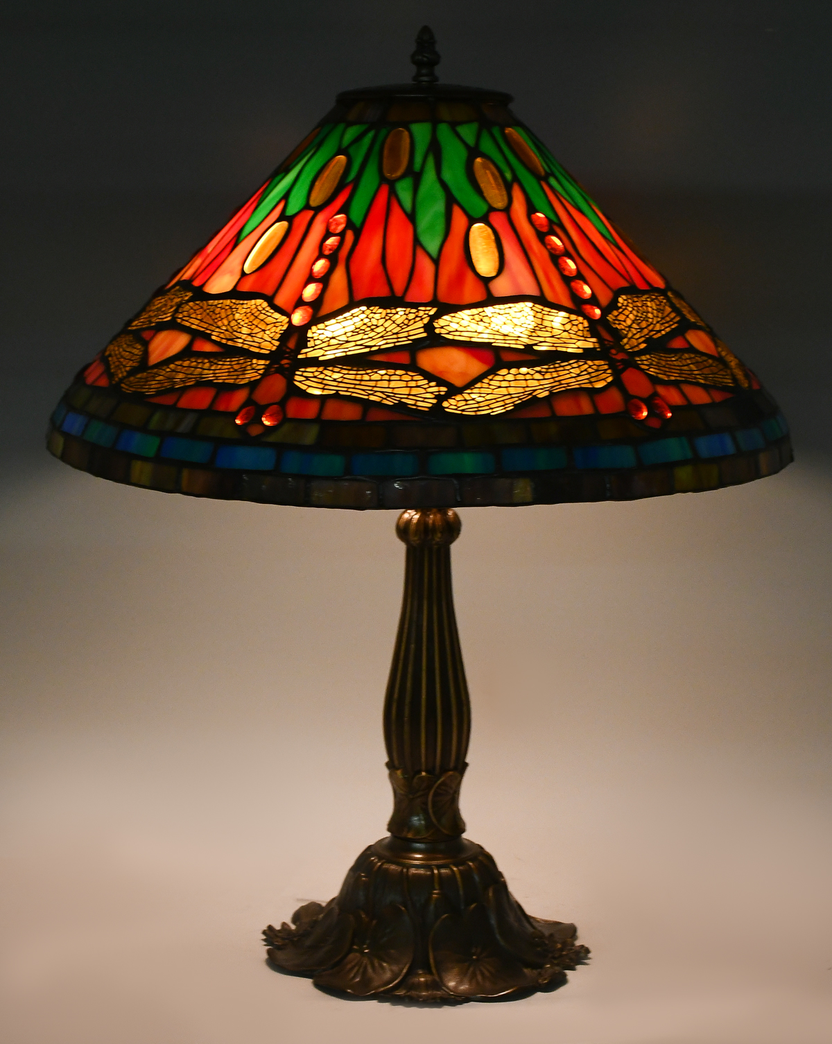 Appraisal: STAINED GLASS DRAGONFLY TABLE LAMP Colorful leaded glass dragonfly motif