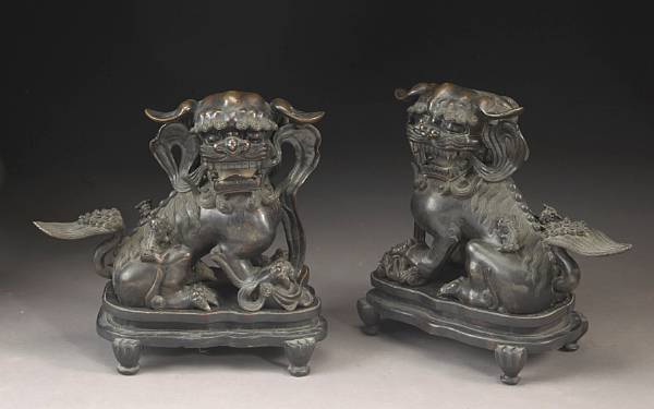 Appraisal: A pair of cast bronze lions with pups th Century